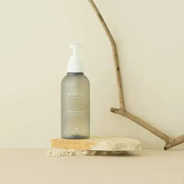 HIKOTA Complete Cleansing Hair Treatment bottle with luxurious shampoo and conditioner formula.