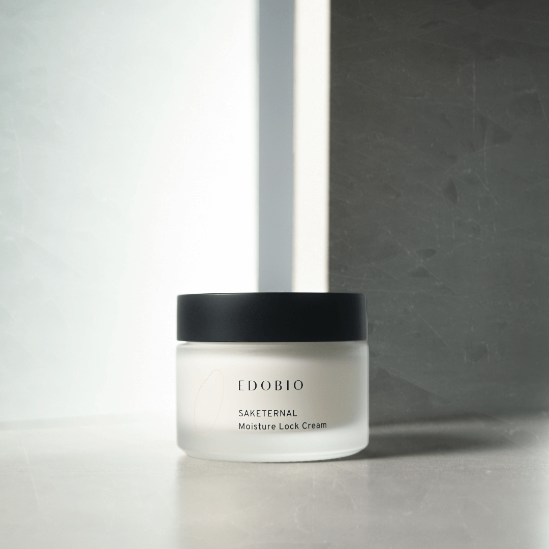 Moisture Lock Cream jar on a marble surface, formulated for dry and aging skin.