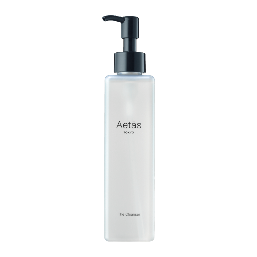 The Cleanser bottle with pump, featuring a 93.30% natural formula enriched with macadamia and argan oils.