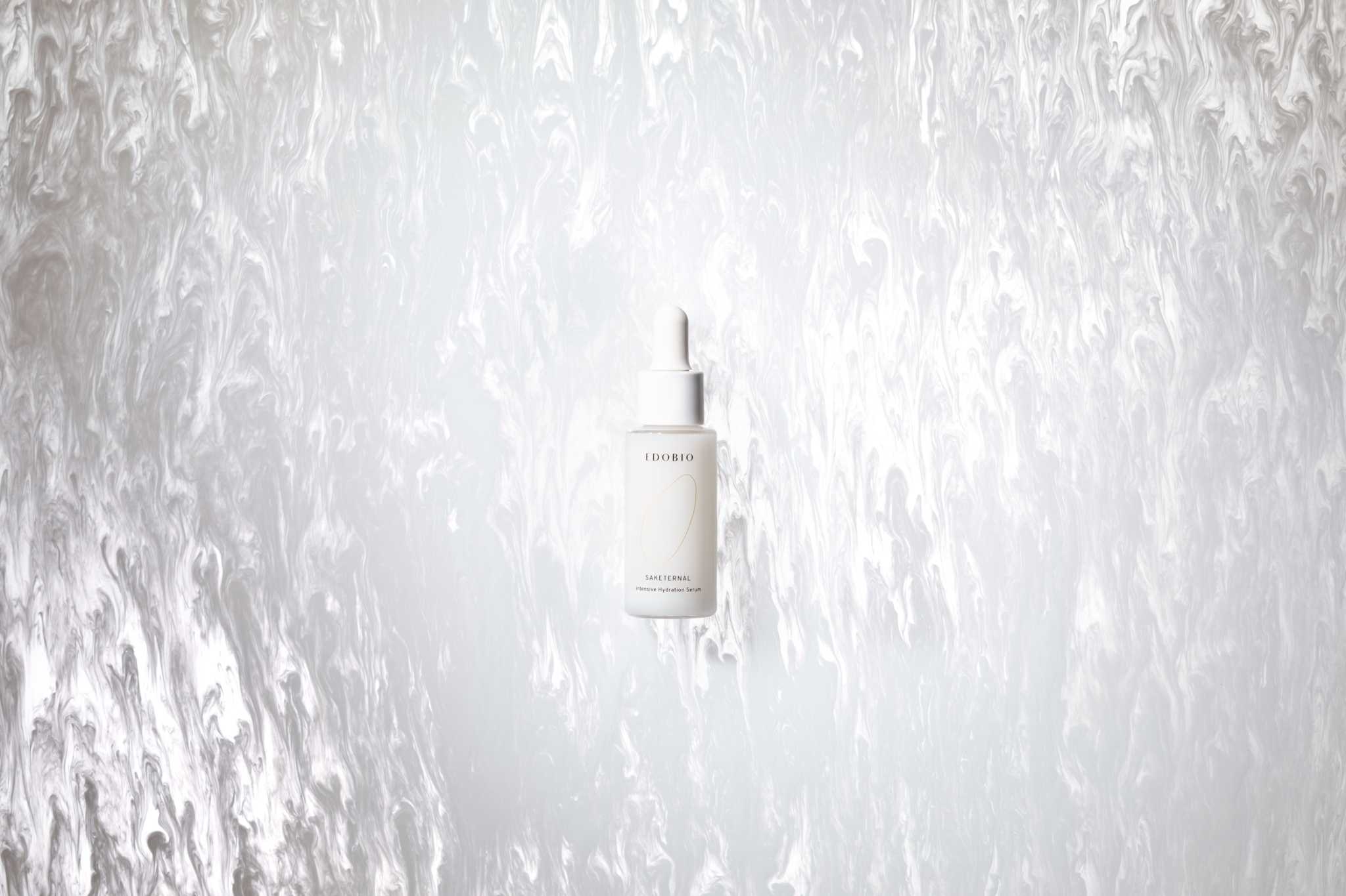Edobio Intensive Hydration Serum bottle with artistic background.