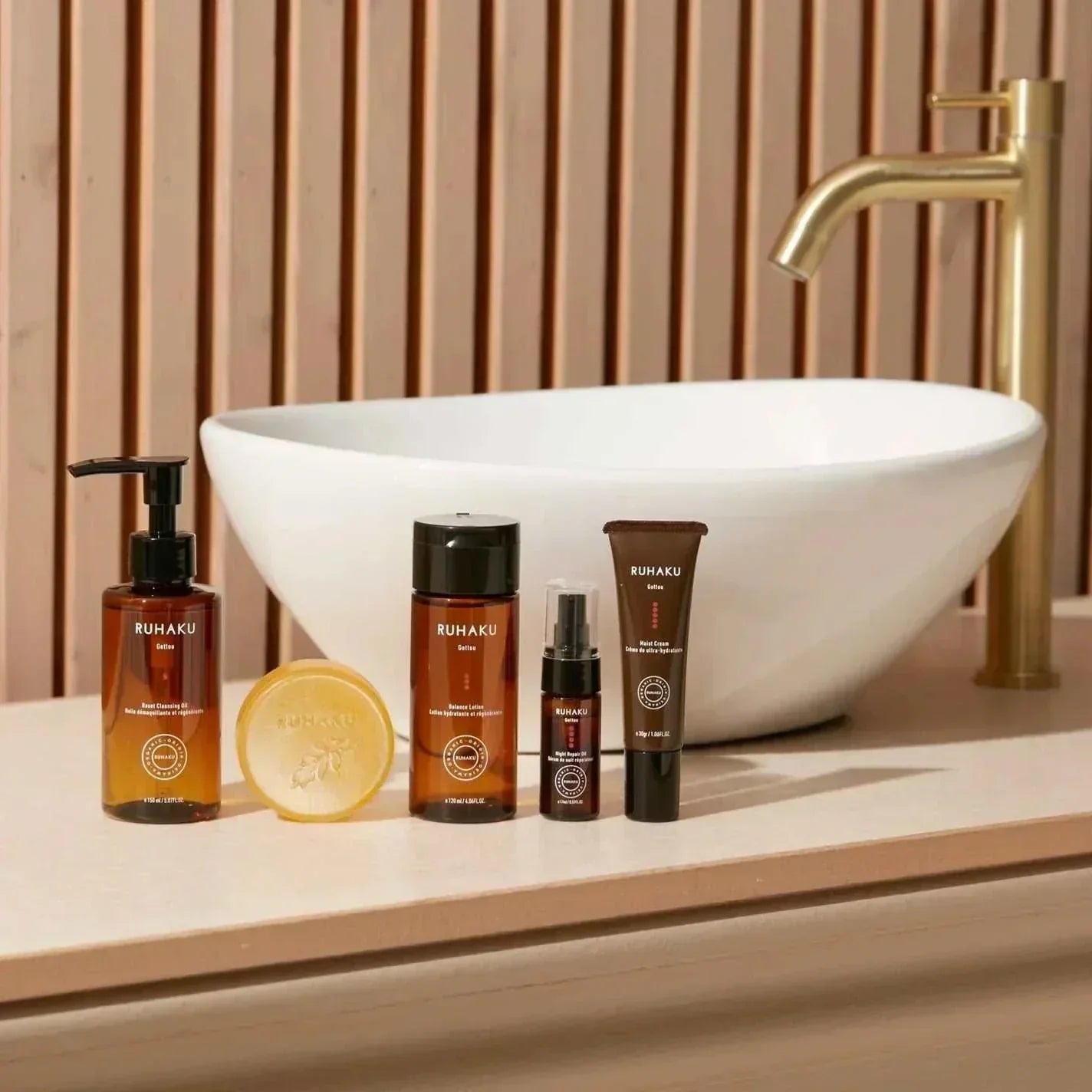 Gettou Cleansing Overnight Face Oil with Okinawan shell ginger extract and natural essential oils, displayed with similar skincare products.