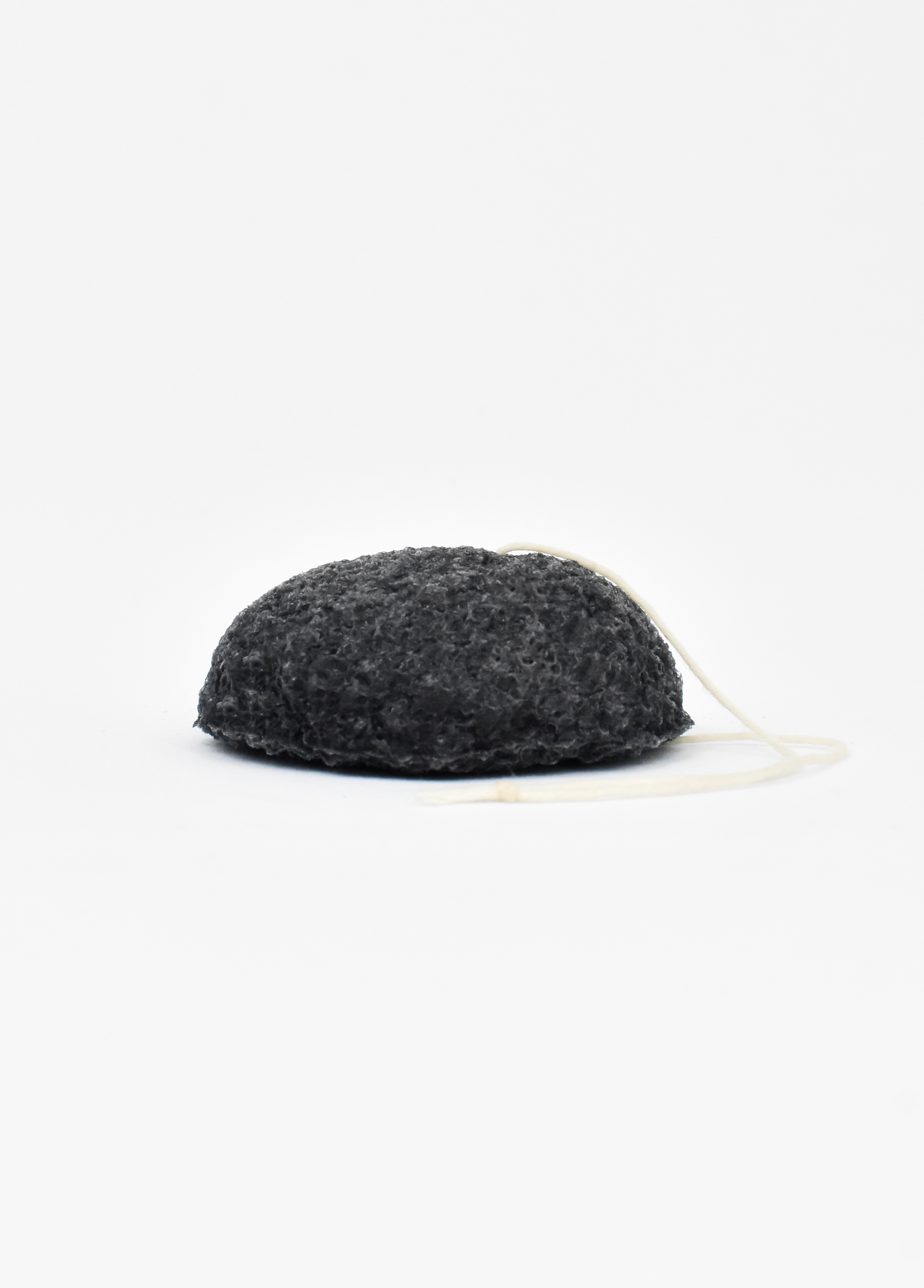 Shikohin Plant-Based Charcoal Konjac Sponge for detoxifying and oil removal, suitable for all skin types.