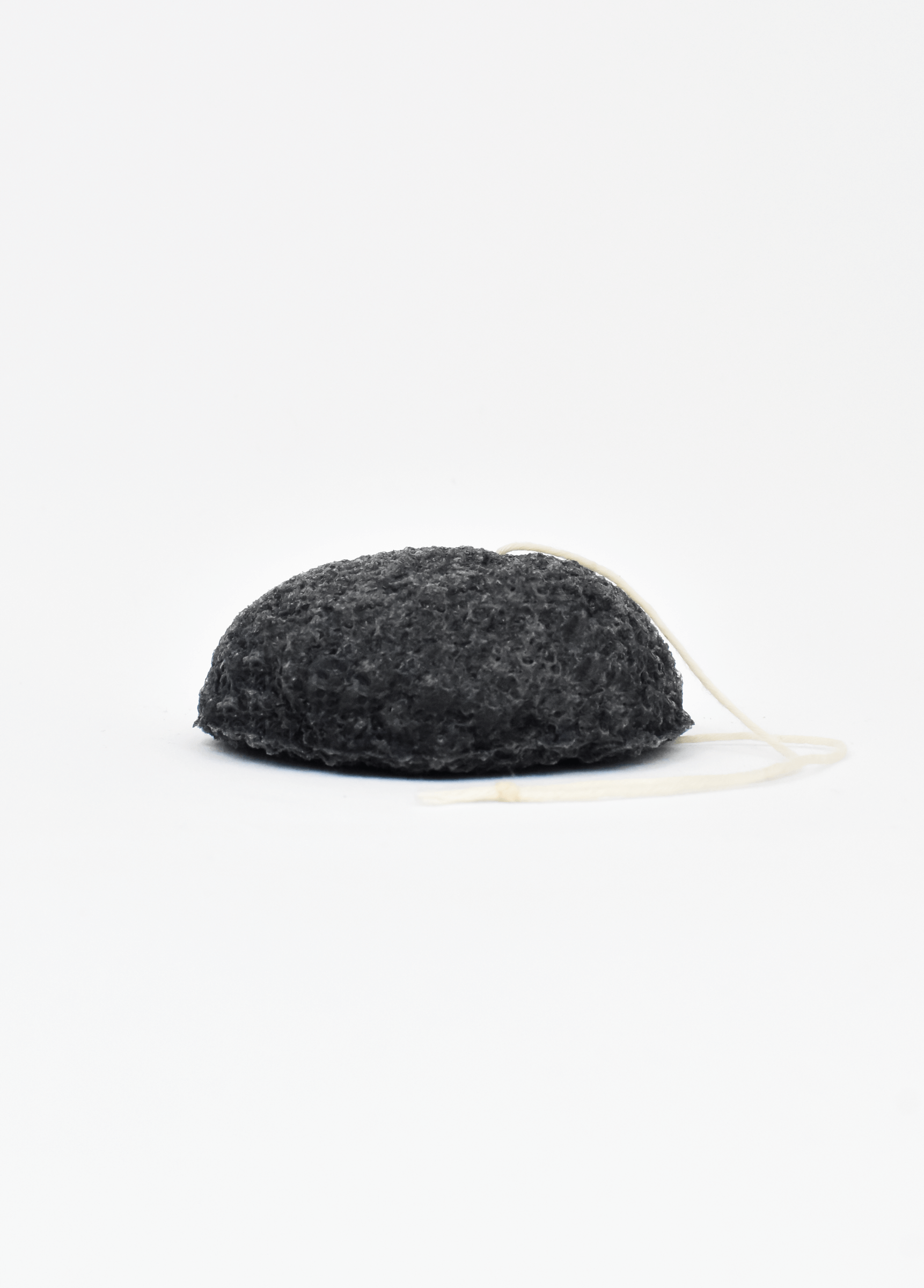 Shikohin Plant-Based Charcoal Konjac Sponge for detoxifying and oil removal, suitable for all skin types.