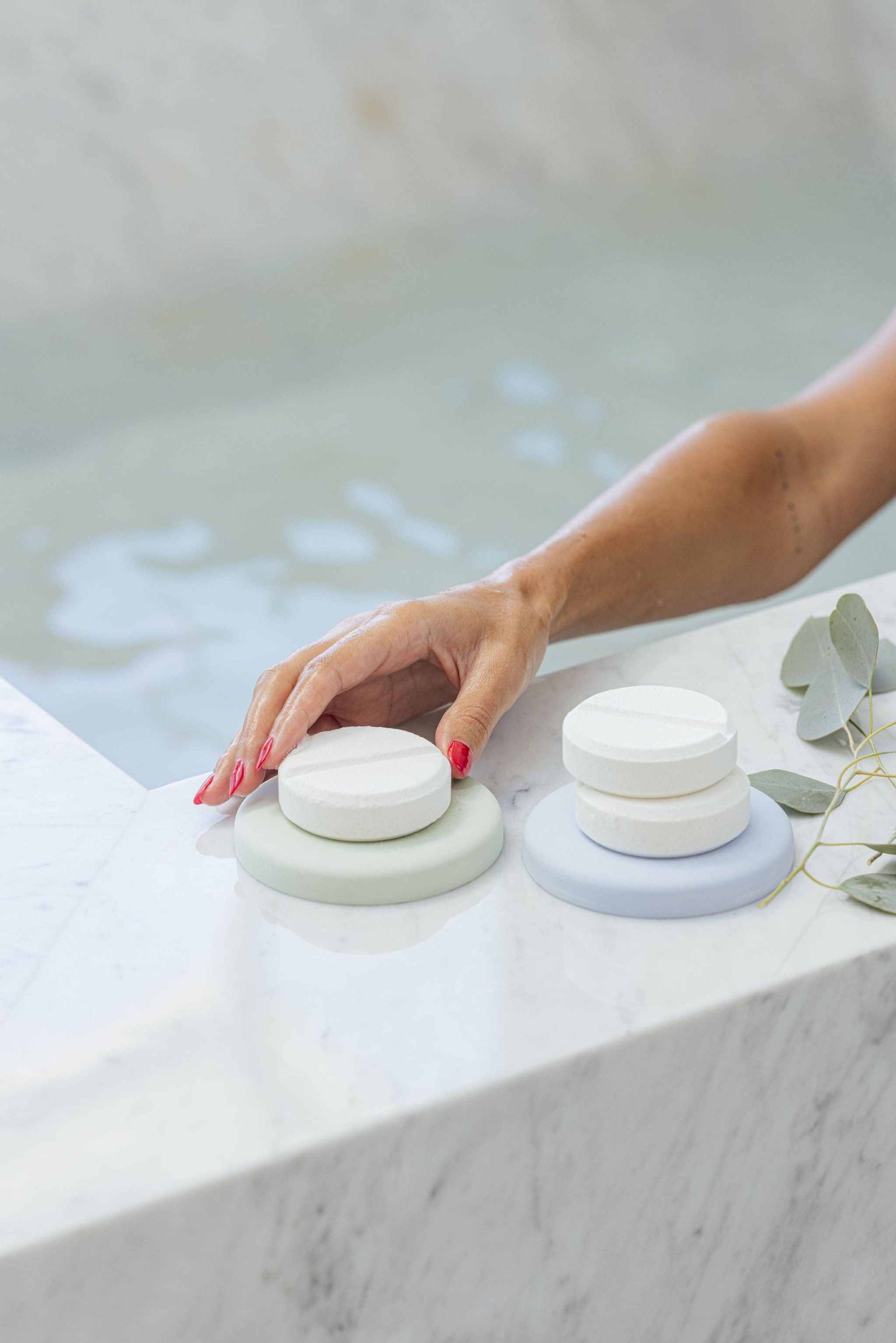 Onsen Bath Tablets 3 pc next to a marble bath edge.
