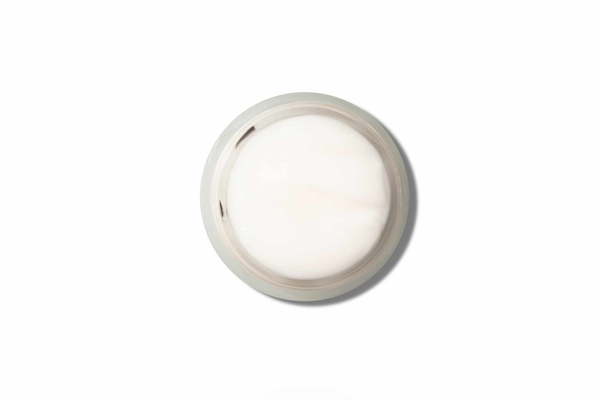 Glowing Night Gel Mask in open jar, white creamy texture.