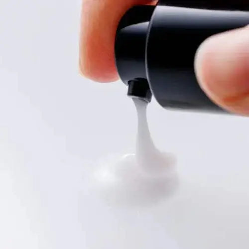 Applying The Moisturizer, ultra-hydrating skin care product dispensed from a bottle.