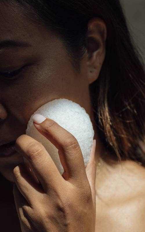 Shikohin Plant-Based Konjac Sponge gently exfoliating and cleansing skin.