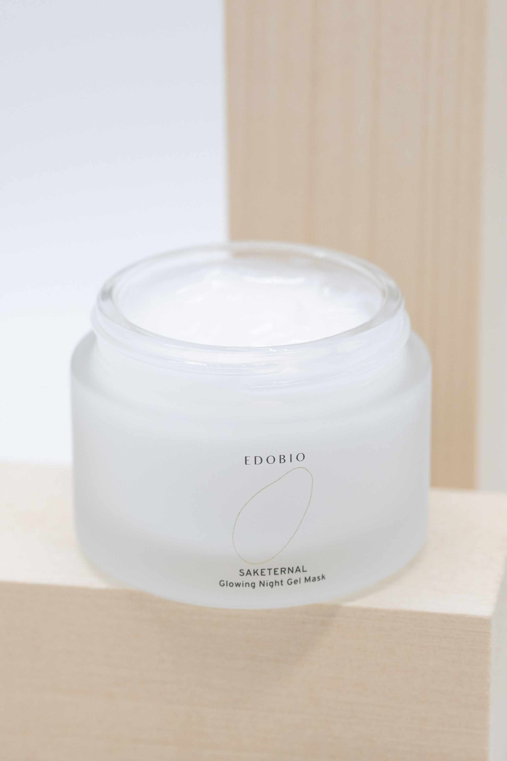 Glowing Night Gel Mask in frosted jar with hydrating formula.