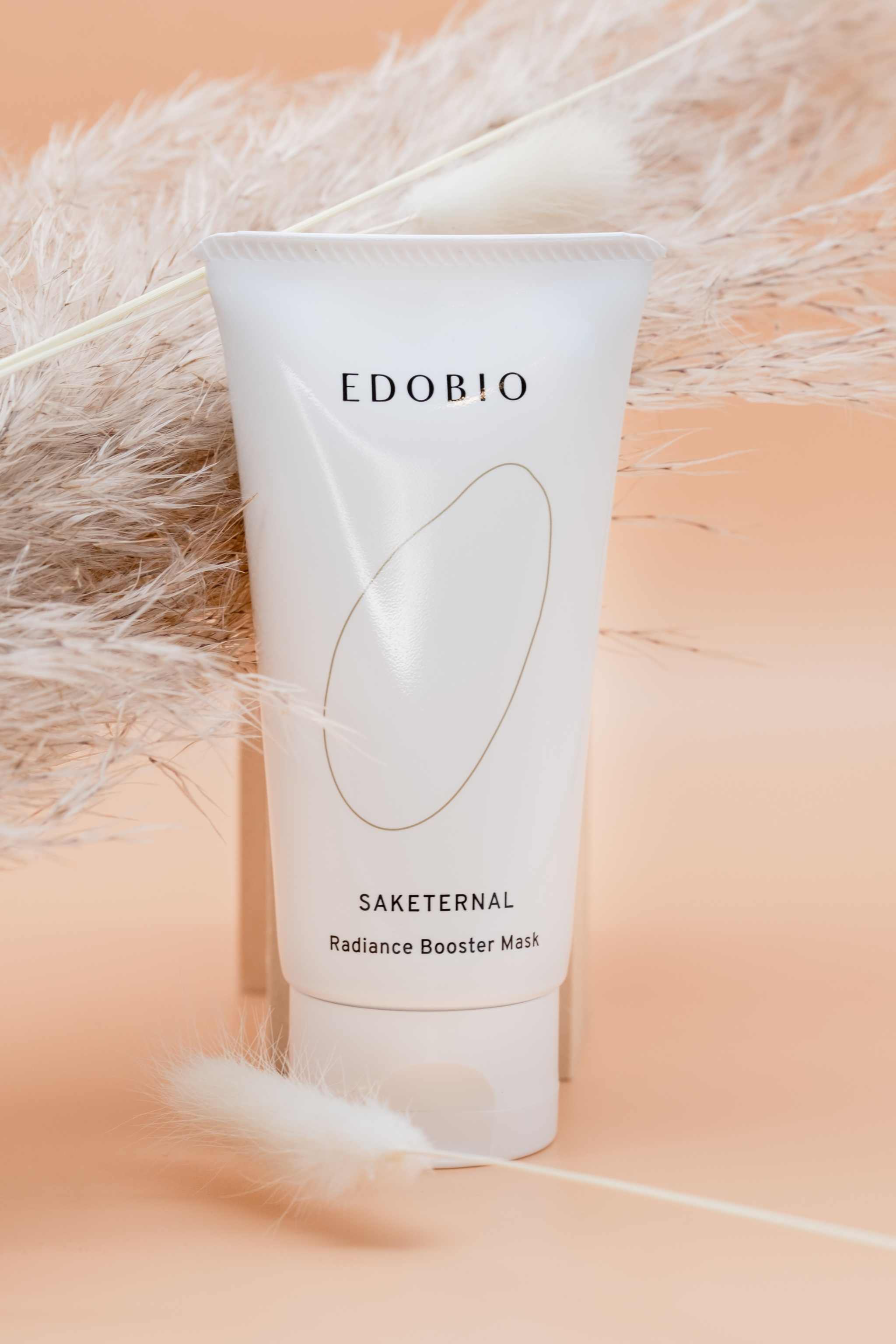 Edobio Radiance Booster Clay Face Mask for brightening complexion, EDOBIO packaging displayed.