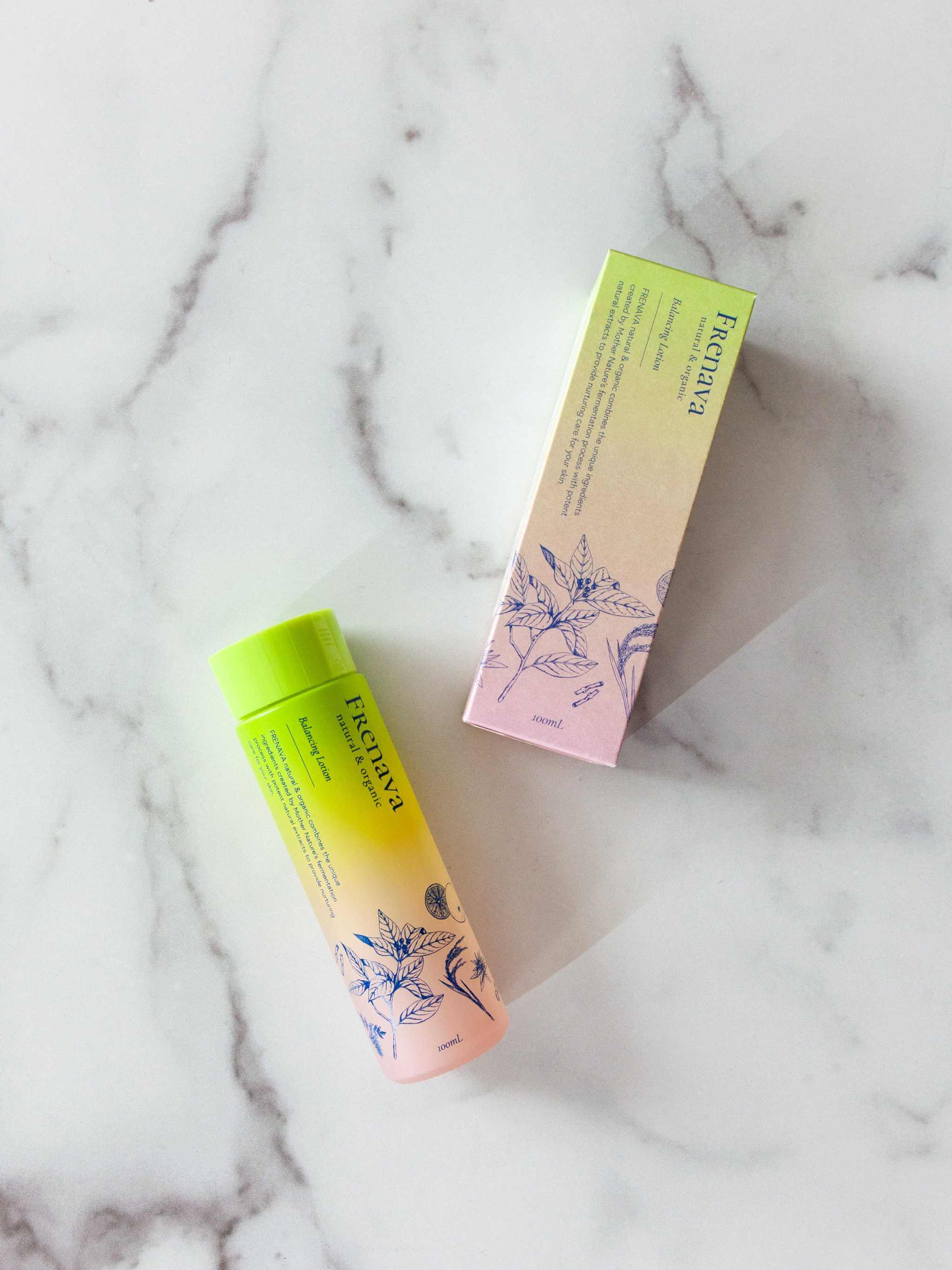 Frenava Balancing Lotion with Kuro-moji water and organic sake extracts on marble surface.