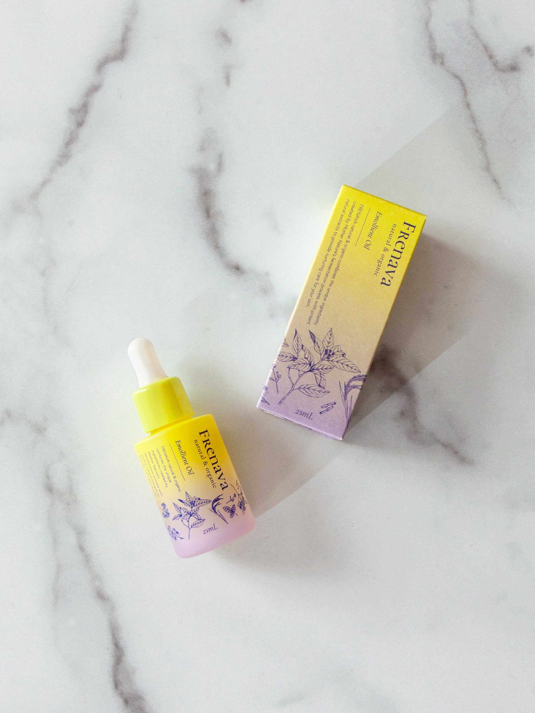 Frenava Emollient Oil with sake lees extract and Squalane on marble surface.