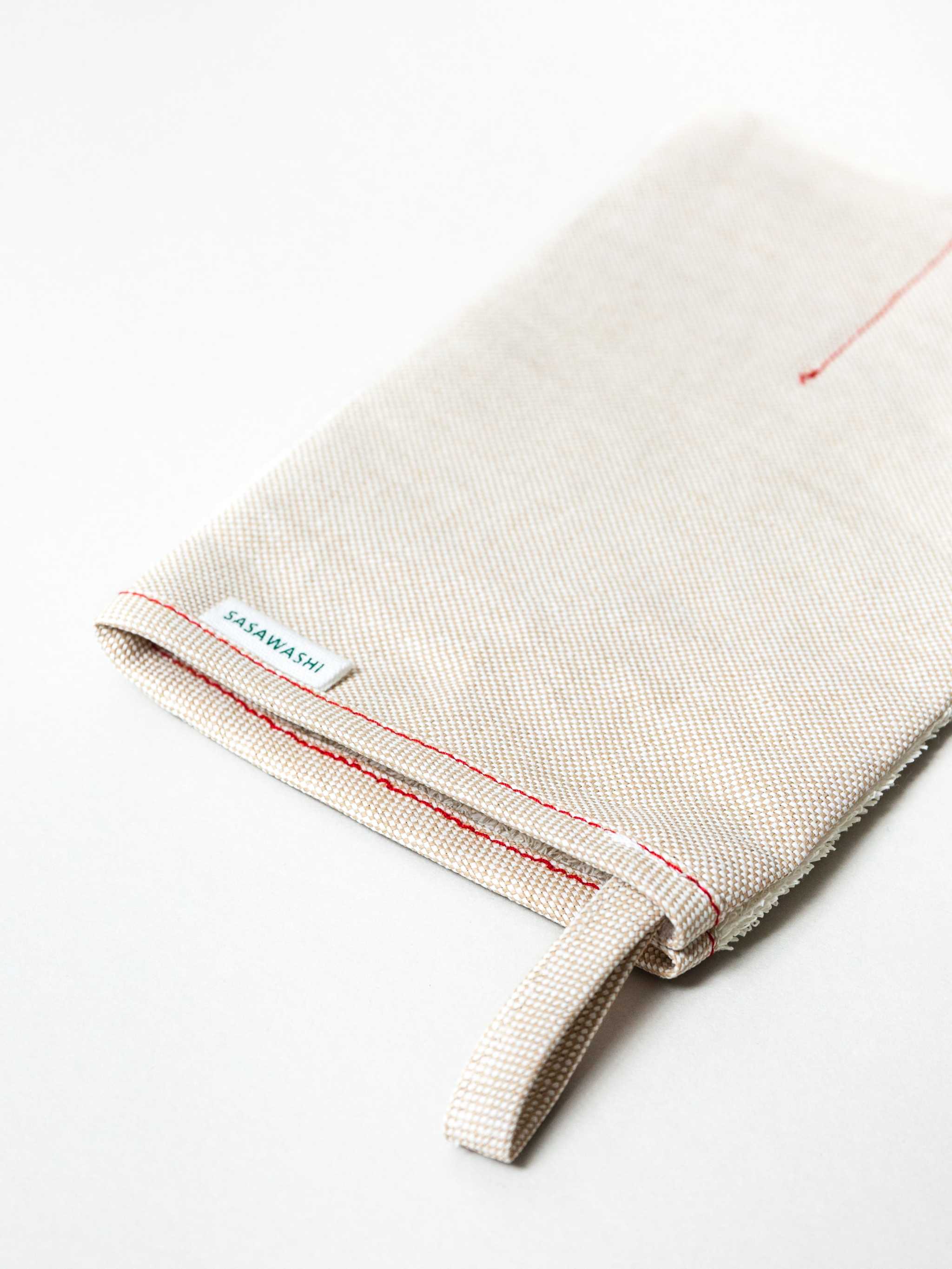 Sasawashi Deep Exfoliating Body Scrub Mitt for invigorating and refreshing skin care.