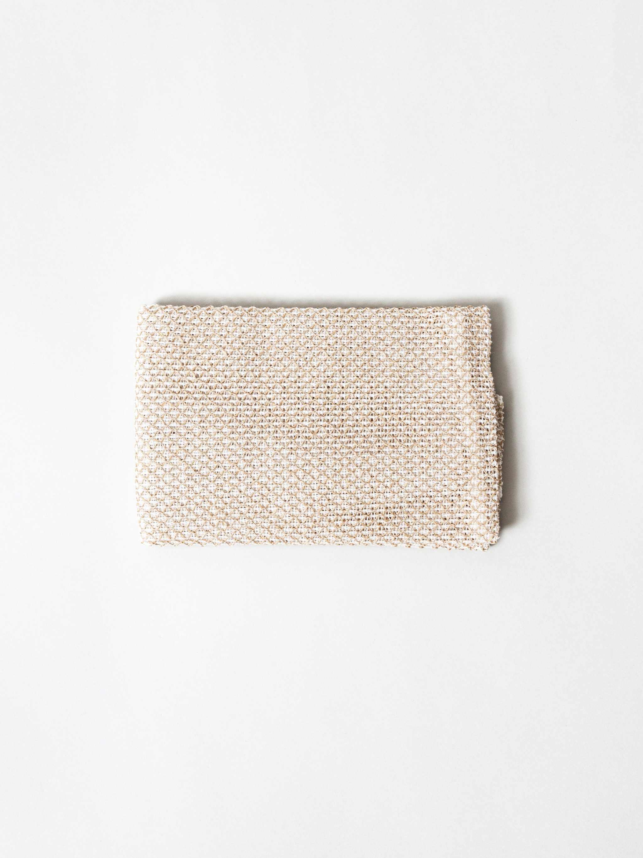Sasawashi Mesh Body Scrub Towel for exfoliating skin.