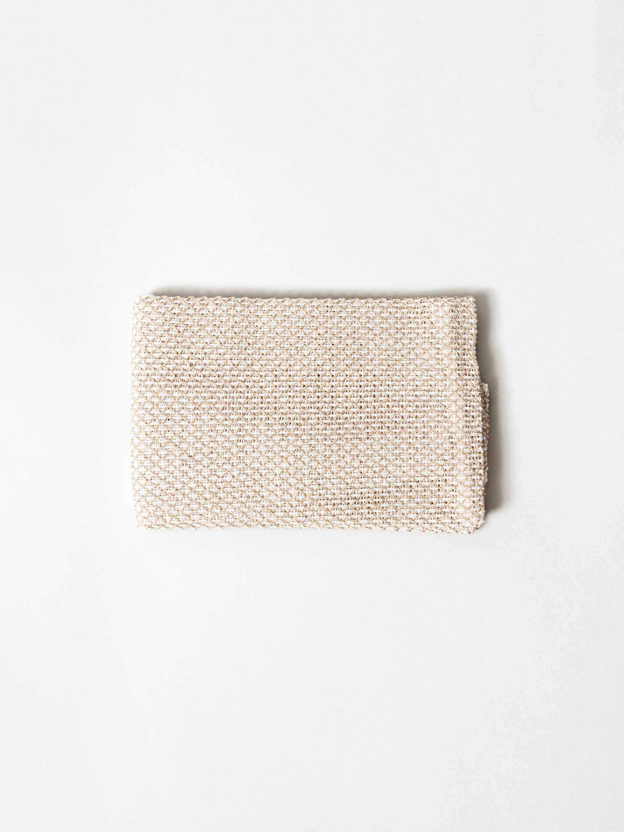 Sasawashi Mesh Body Scrub Towel for exfoliating skin.