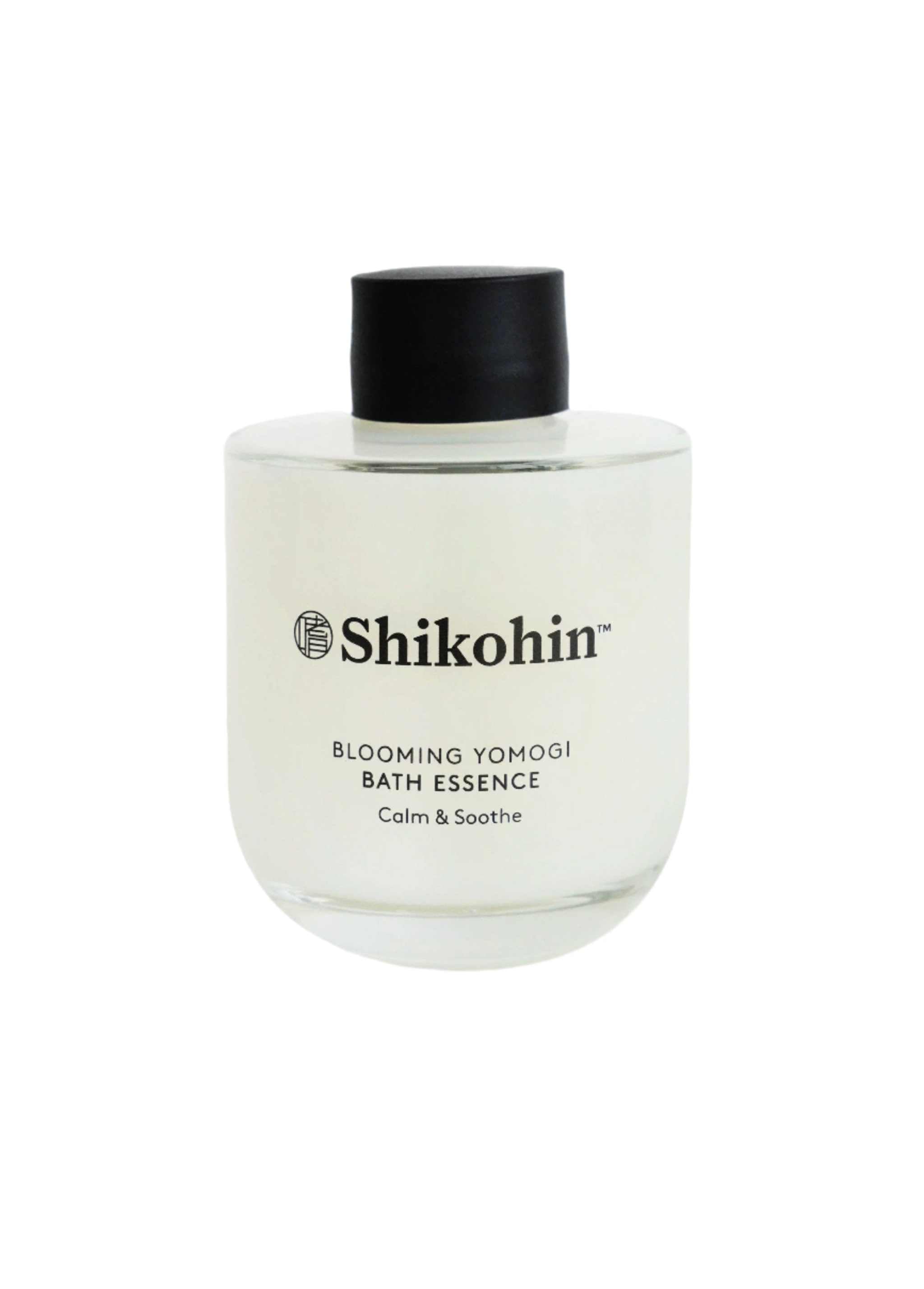 Yomogi Bath Soak in clear bottle with black cap, Shikohin branding.