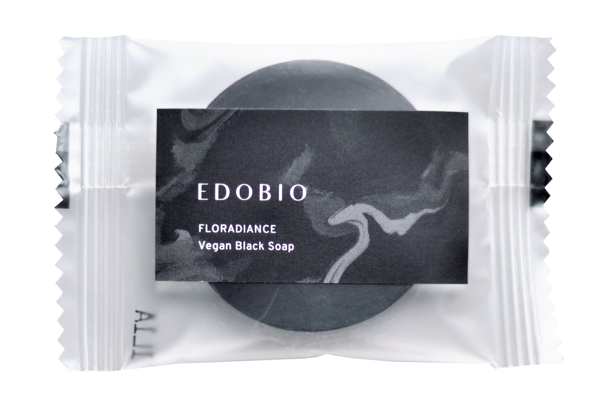 Mini Vegan Black Soap with charcoal and lactic acid, packaged for refill.