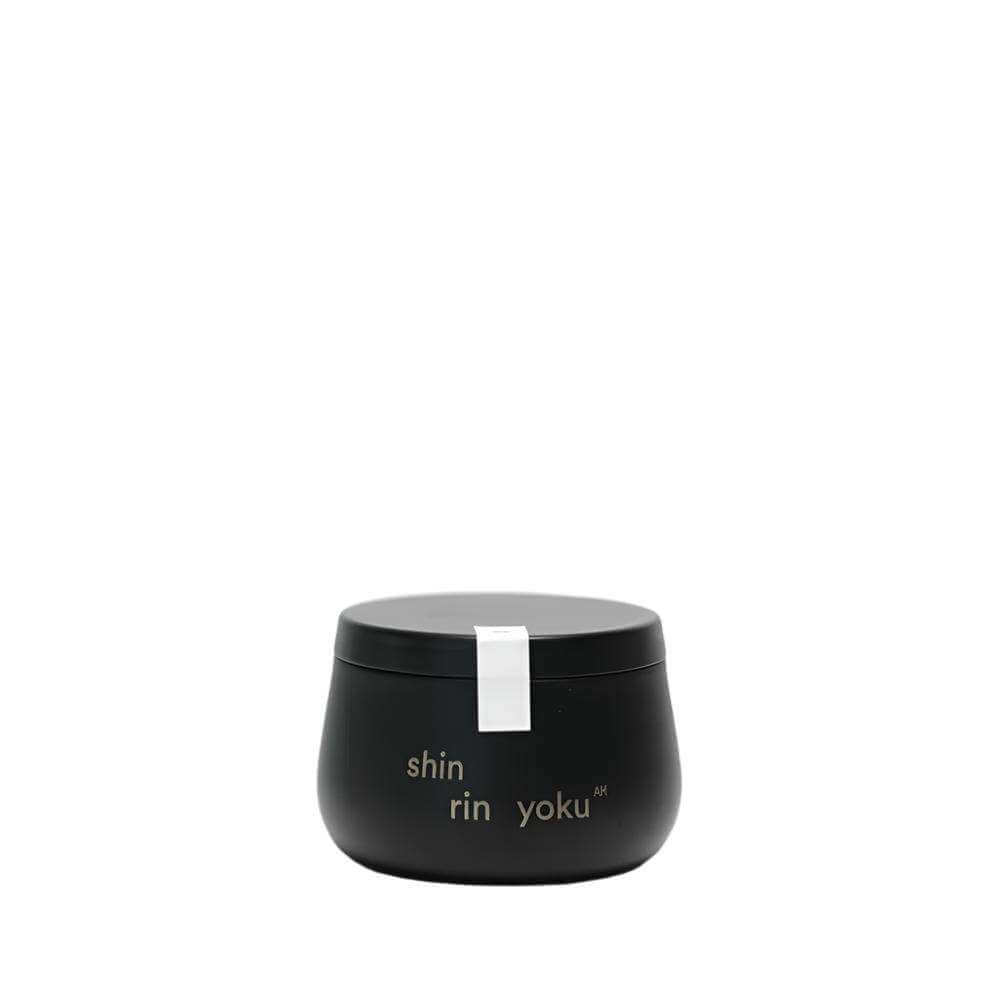 Hinoki Candle AM in black container, made with natural Hinoki trunk oil from Hinohata Village, Japan.