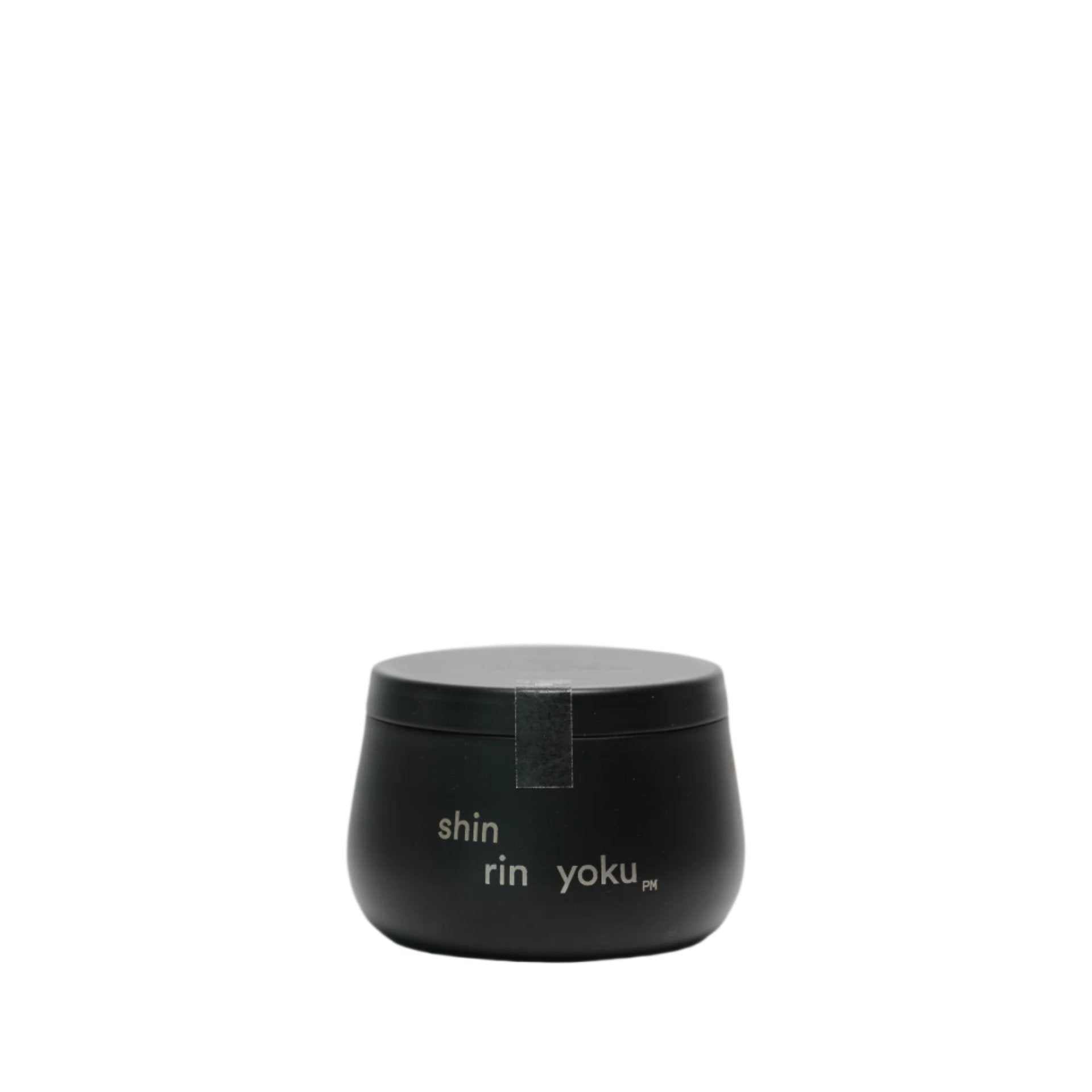 Hinoki Candle PM in minimalist black jar with hinoki leaf essential oil scent.