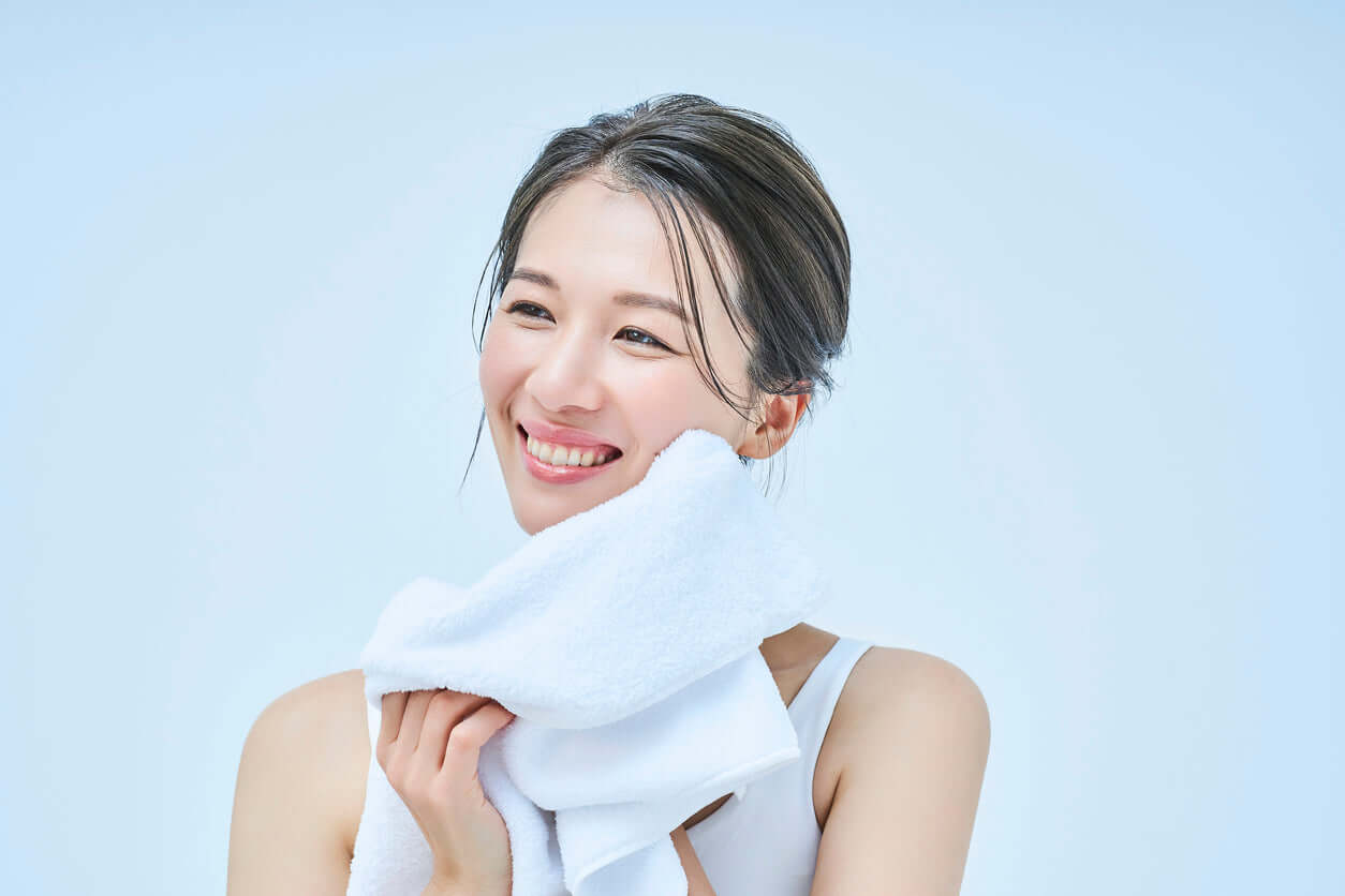 Woman practicing Japanese skincare rituals 