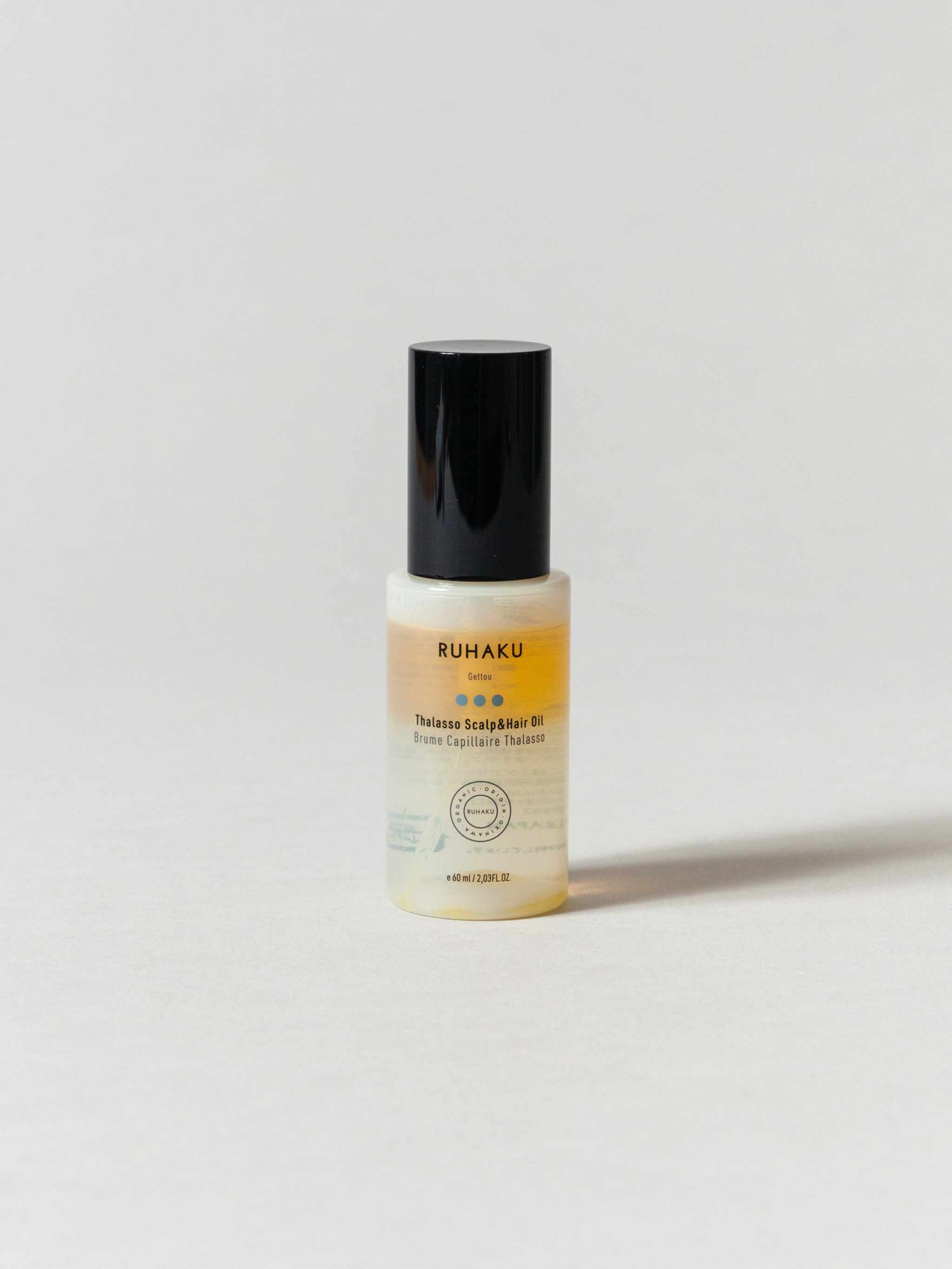 Thalasso Scalp & Hair Oil bottle with aloe vera, gettou leaf extract, and organic essences for enriched hair and scalp health.