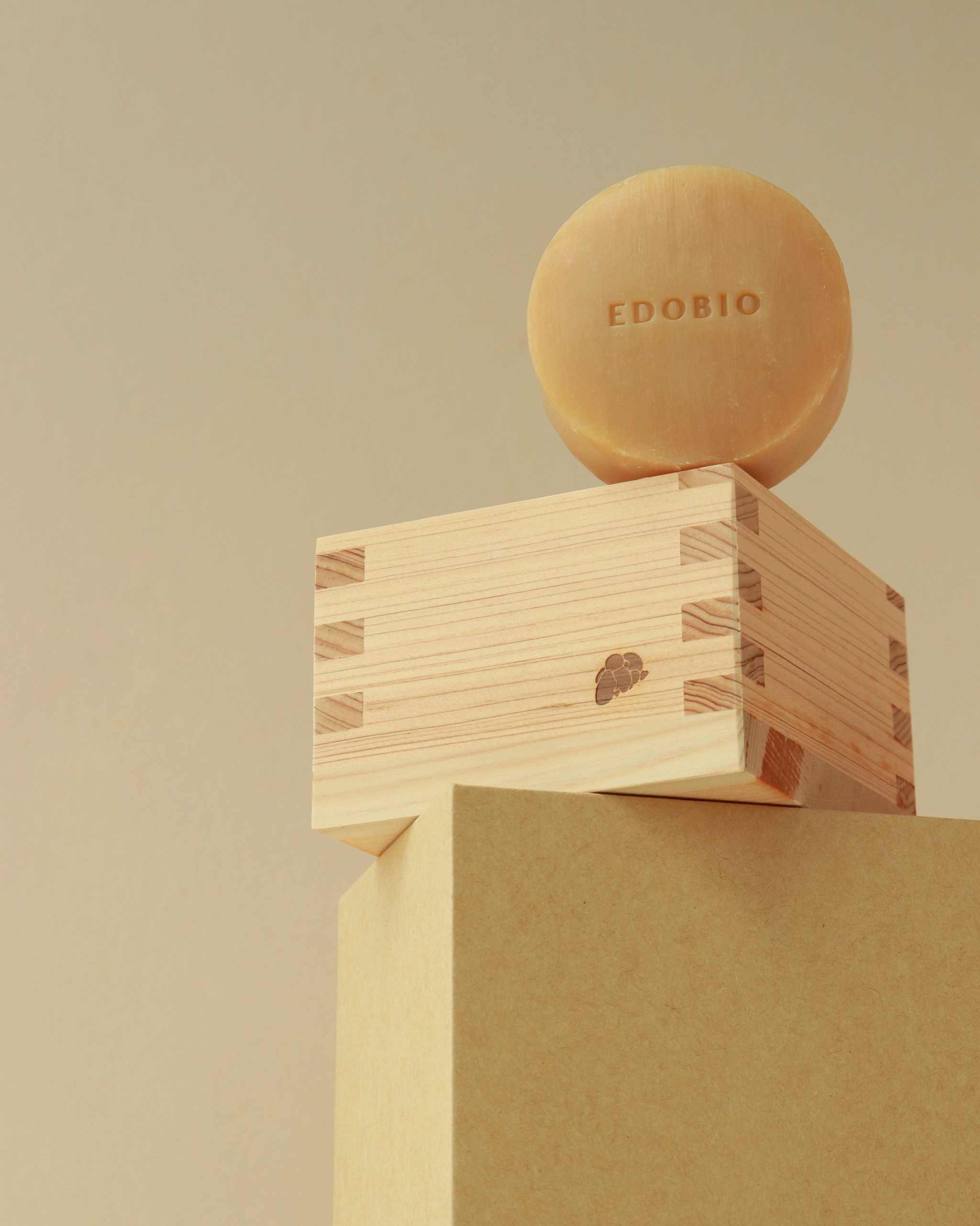 Edobio Masu Moisturizing Souffle Soap Mini with wood dish and foaming net on display.